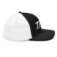 Load image into Gallery viewer, Two baseball caps, one white and one black with a logo, on a white background