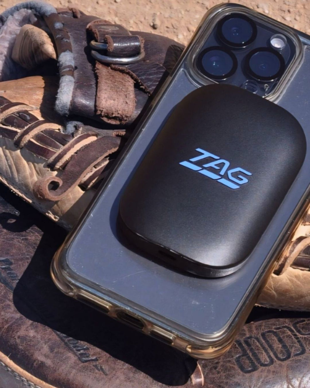 Black device with 'TAG' logo on a textured surface