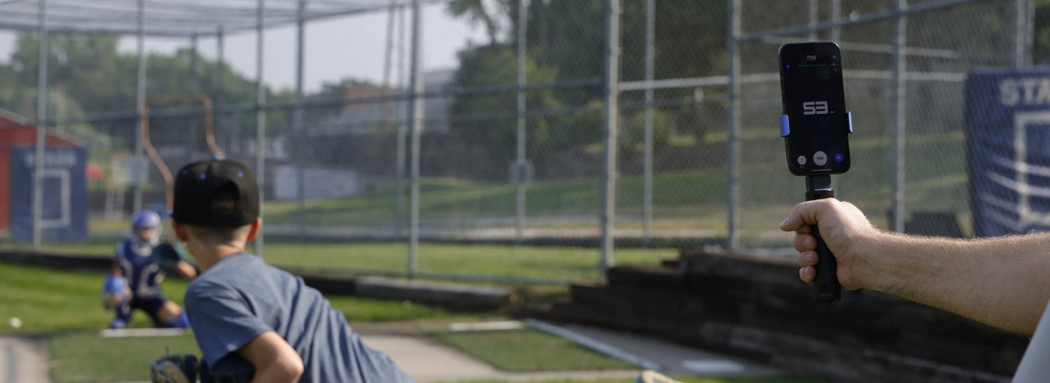 Pitcher throwing a baseball while speed being tracked with TAG One Radar.