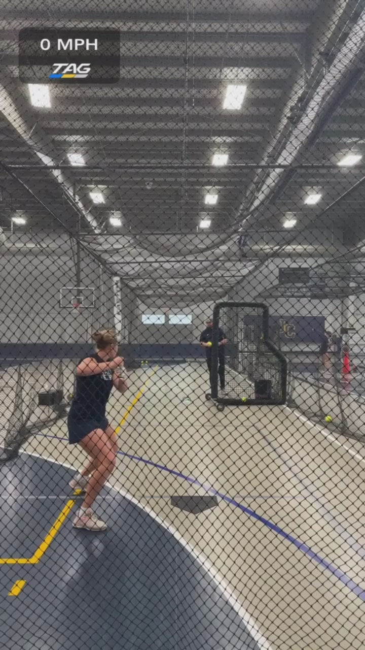 Softball player taking batting practice with a speed overlay.